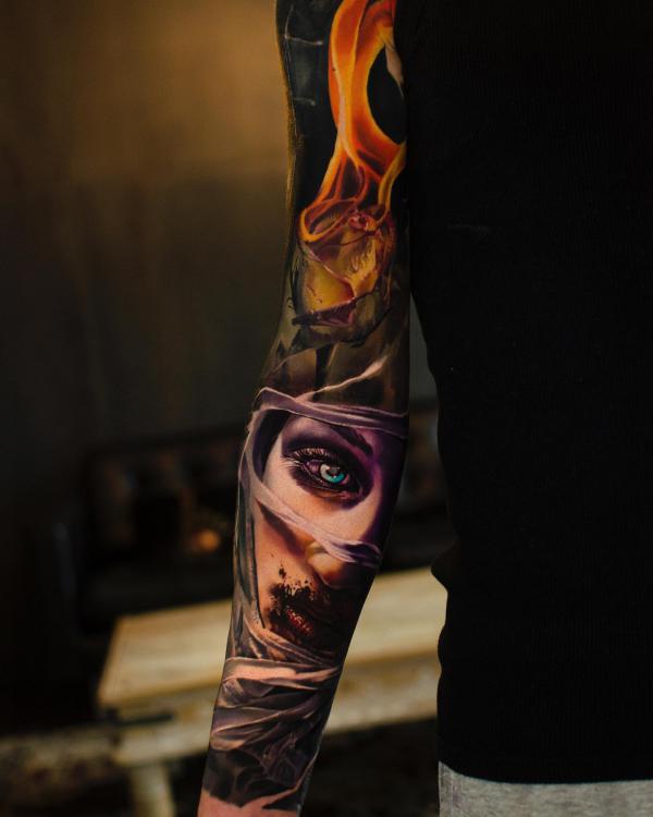 Female eye with flame tattoo sleeve