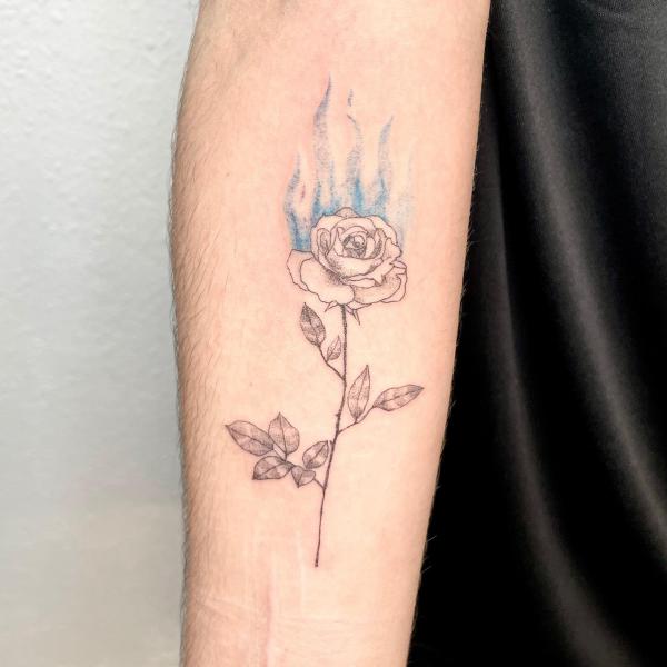 Fine line rose with flame tattoo forearm