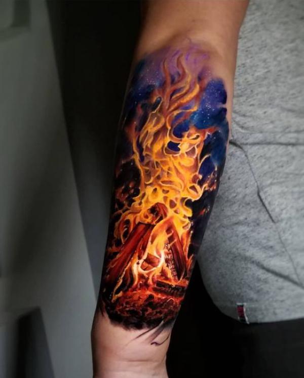 Fire tattoo outer forearm
