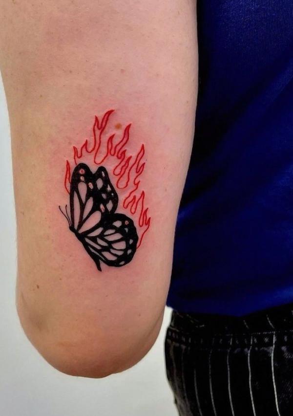 Flame butterfly tattoo on arm