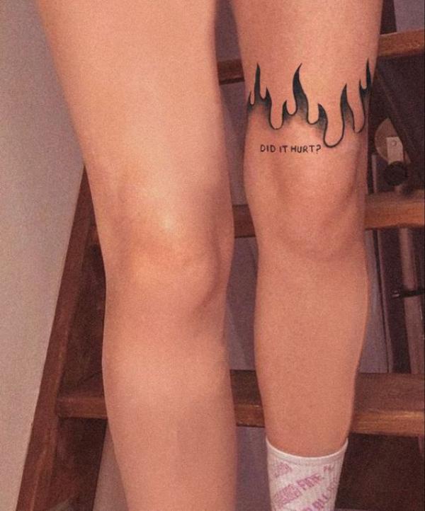 Flame outline knee tattoo