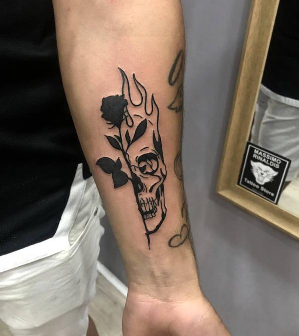 Half rose half skull in fire tattoo black and white