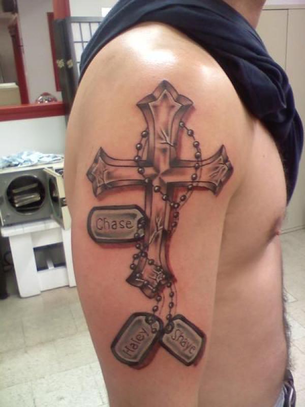 Half sleeve cross and dog tag tattoo