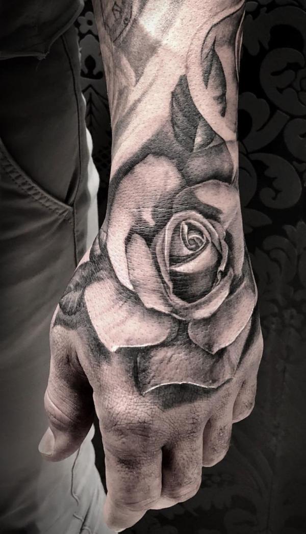 Hand black and white rose tattoo
