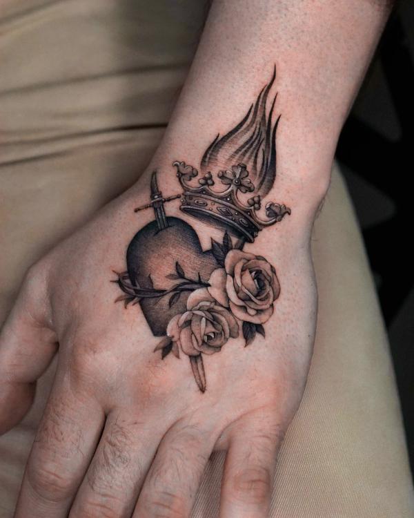Heart with dagger rose crown and fire hand tattoo