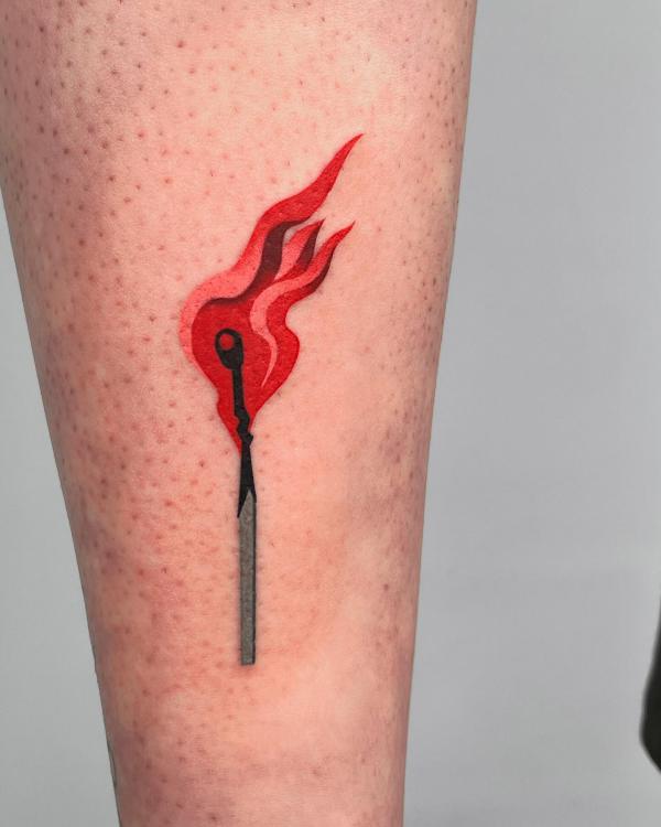 Match lit flame forearm tattoo