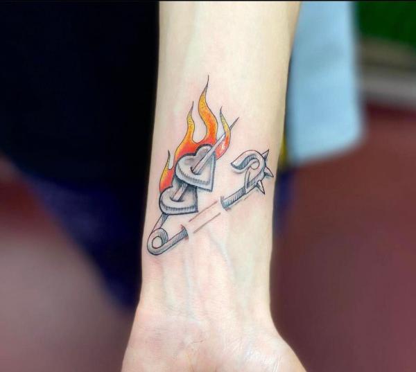Pin with hearts and flame tattoo