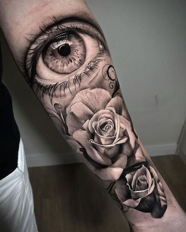 Realistic eye and rose tattoo black and white