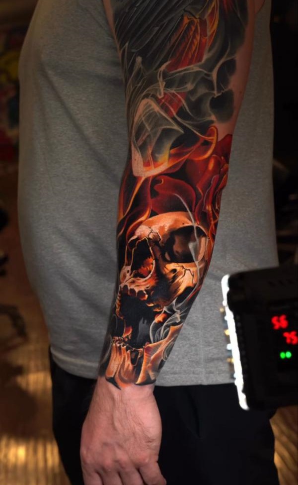Skull and flame tattoo forearm