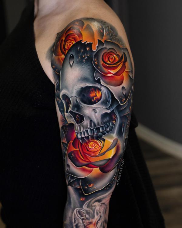 Skull and roses in fire tattoo half sleeve