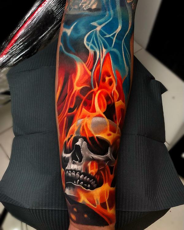 Skull in fire tattoo sleeve