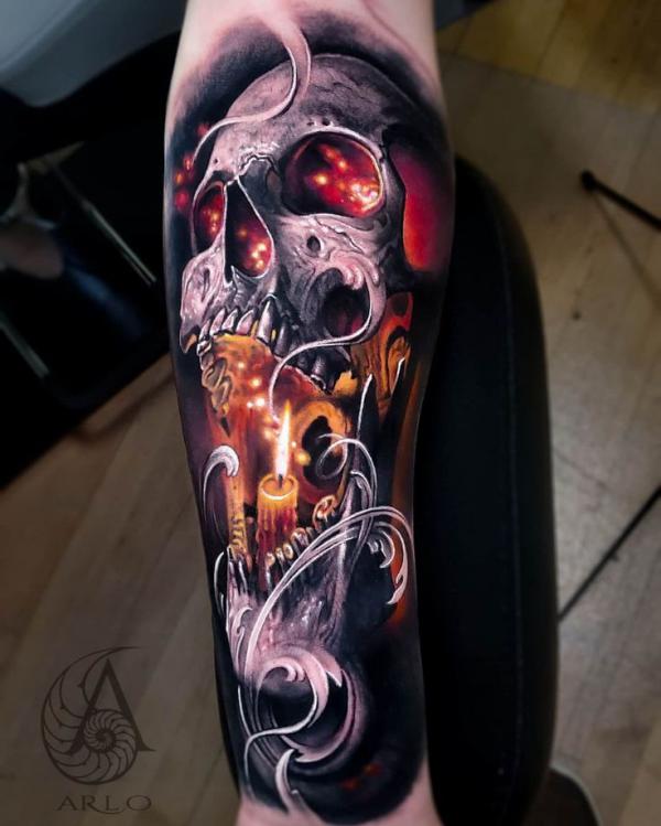 Skull with flame and candle tattoo