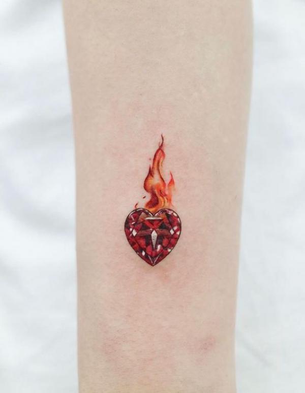 Small diamond heart with flame tattoo