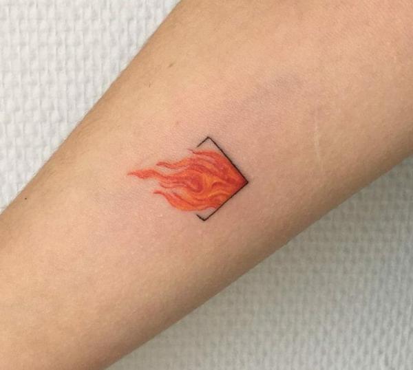 Small fire tattoo on arm