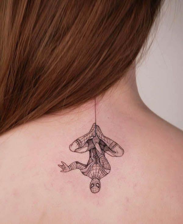 Small hanging spider man fine line tattoo