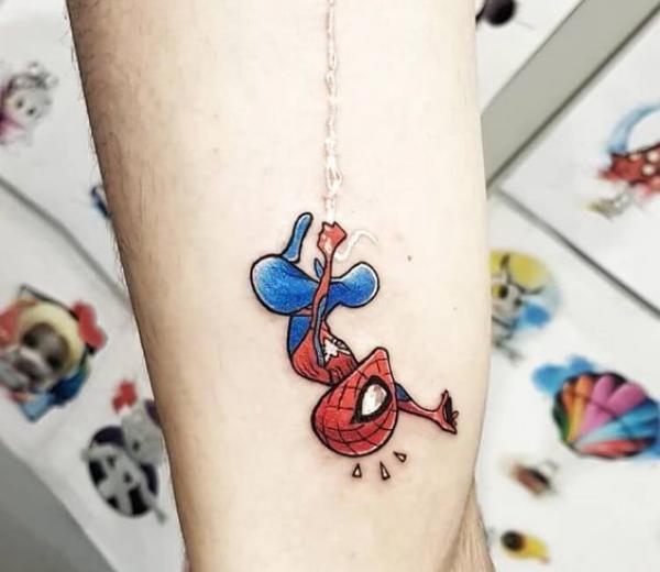 Small hanging spider man tattoo on arm