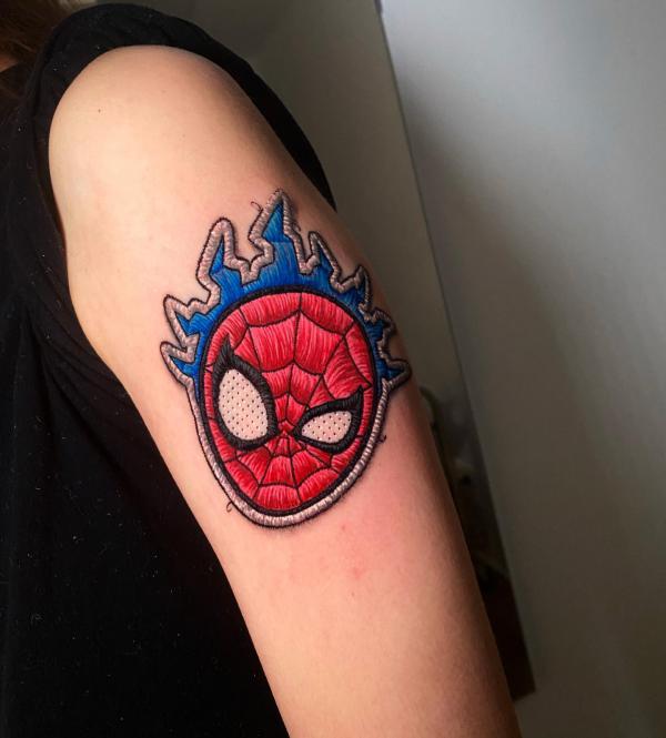 Small spider man head patch tattoo