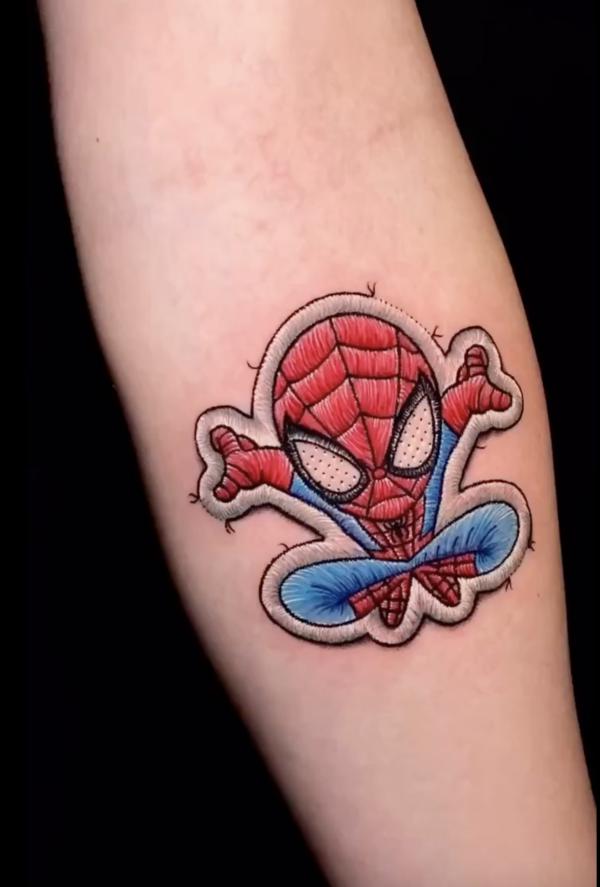 Small spider man patch tattoo