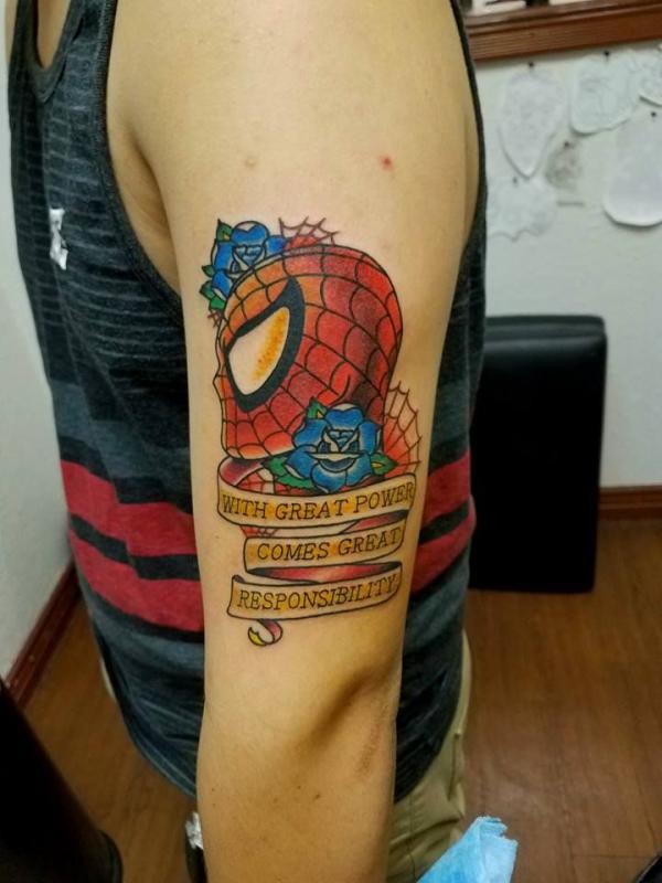 Spider Man tattoo with quote with great power comes great responsibility
