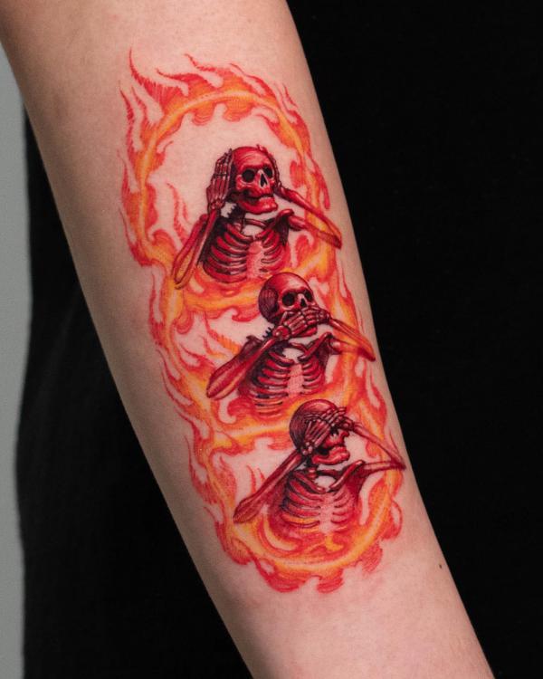 Three skeletons tattoo in fire tattoo forearm