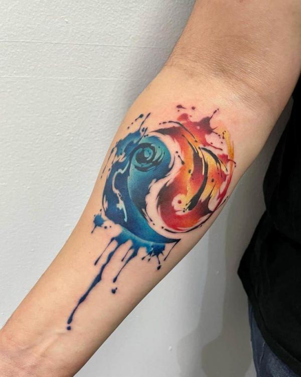 Watercolor fire and water Yin Yang tattoo forearm