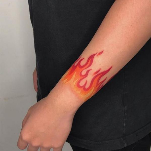 Wrist fire tattoo