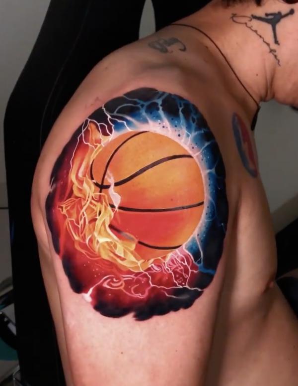 basketball in flame shoulder tattoo