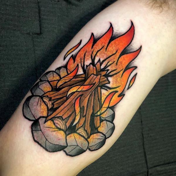camp fire bicep tattoo