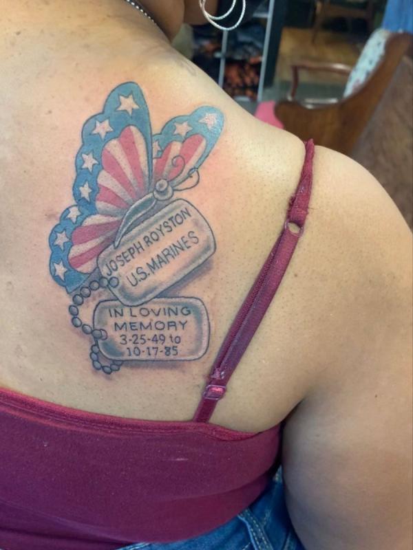 dog tag and American flag butterfly tattoo