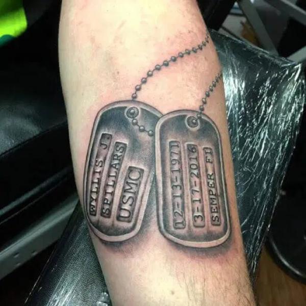 dog tag forearm tattoo
