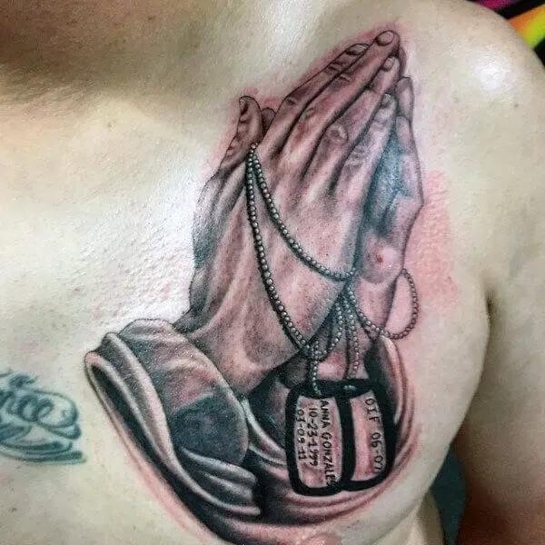 dog tag with praying hands tattoo