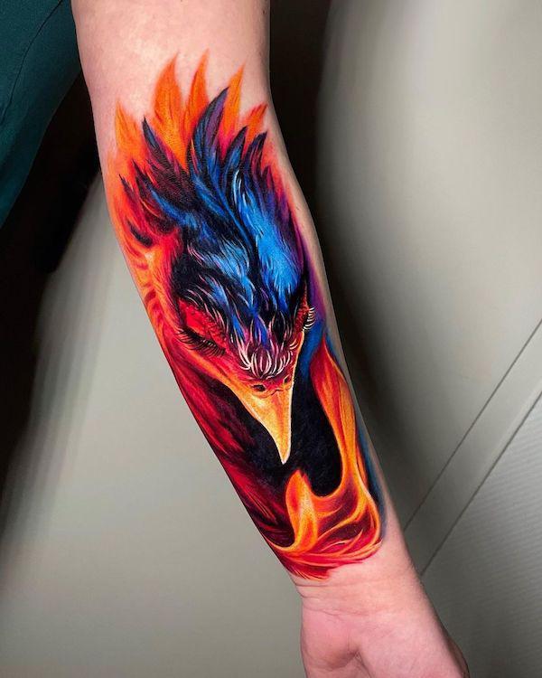 phoenix head in fire tattoo