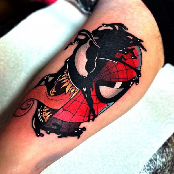 venom spider man bicep tattoo