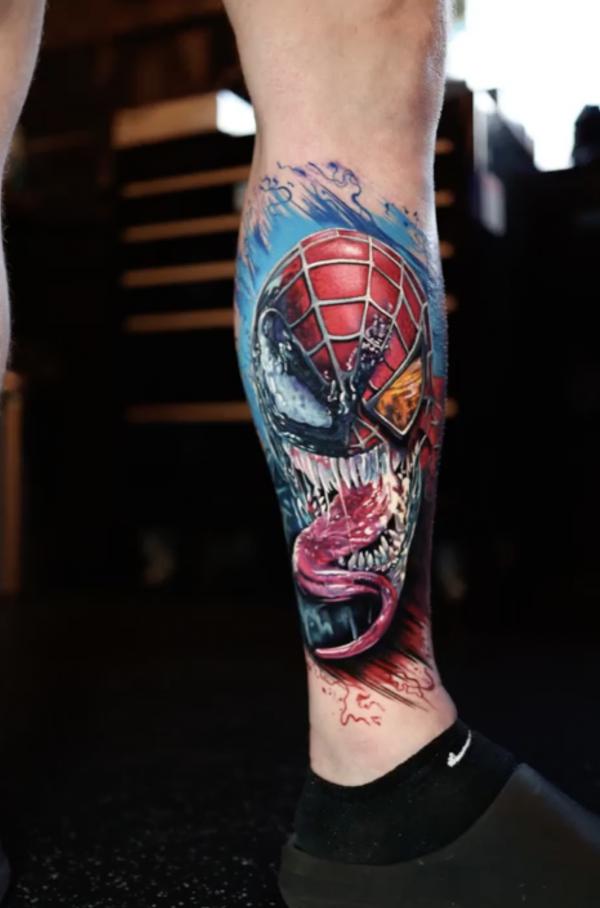 venom spider man tattoo lower leg