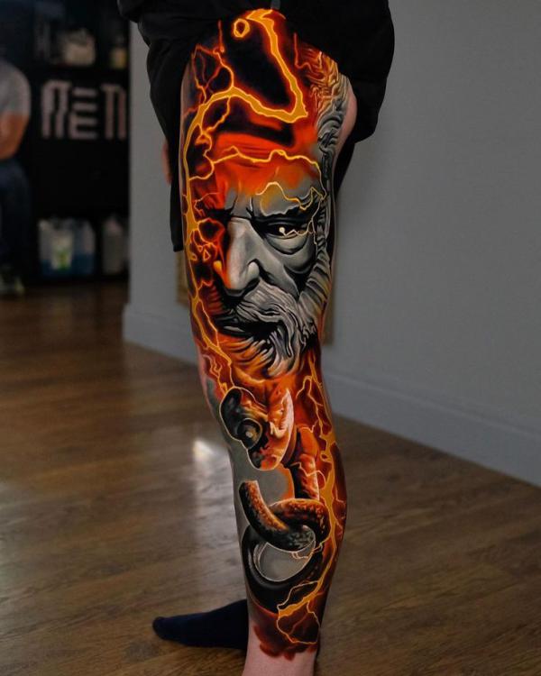zeus with lightning bolt and fire tattoo leg sleeve
