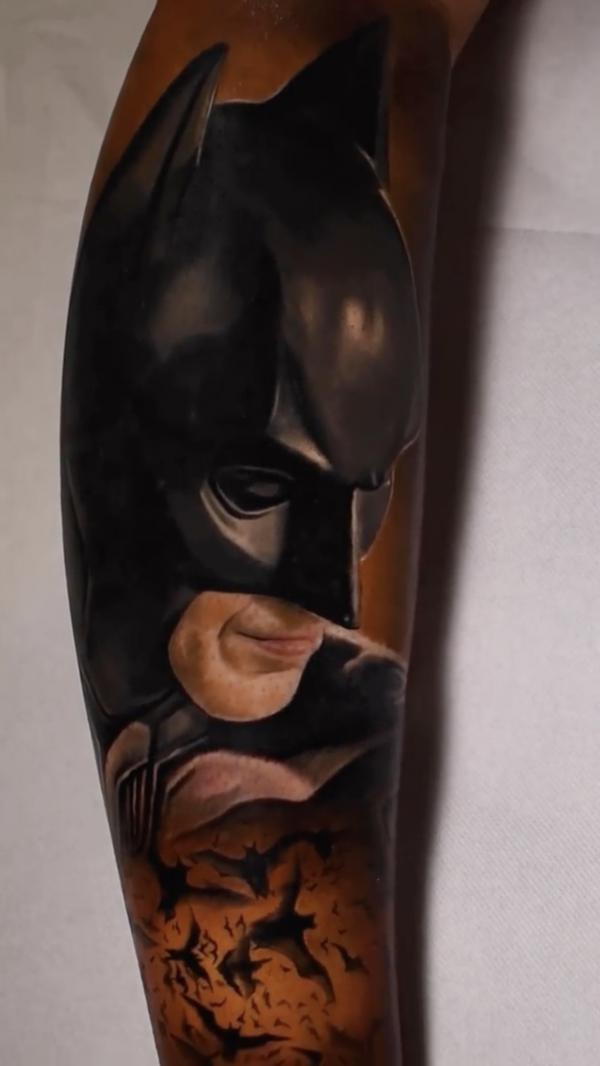 Batman and bats forearm tattoo