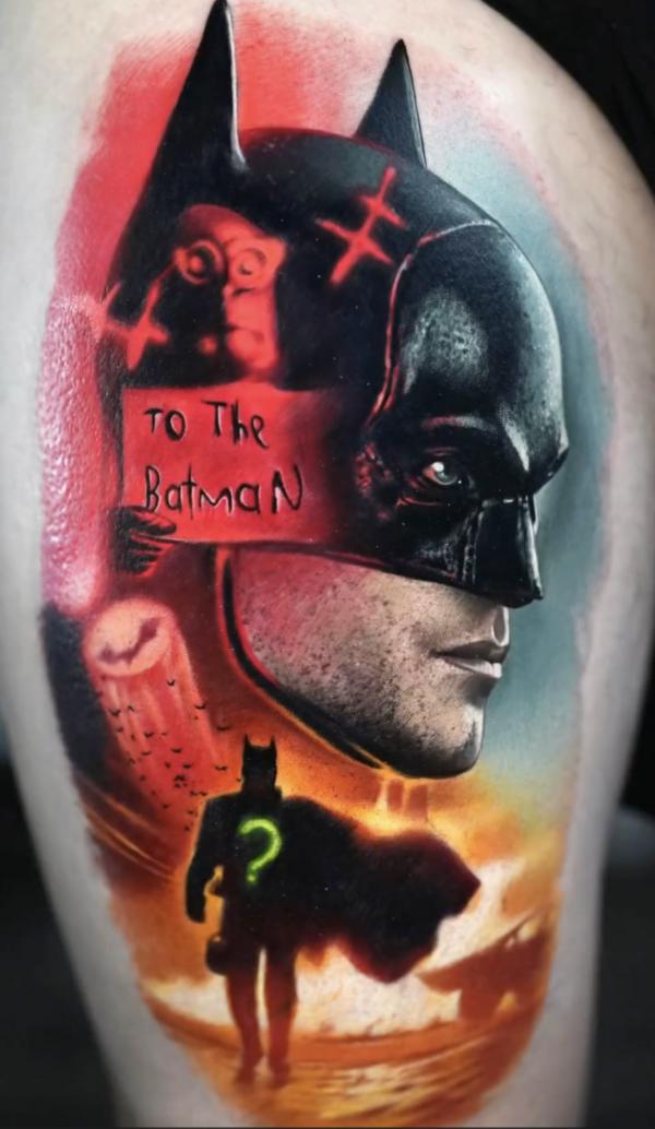 Batman with words tattoo thigh