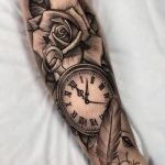 Black and grey rose and pocket watch with feather tattoo
