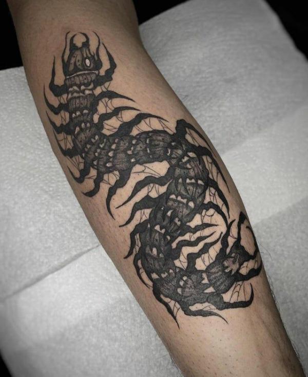 Black and white centipede tattoo traditional