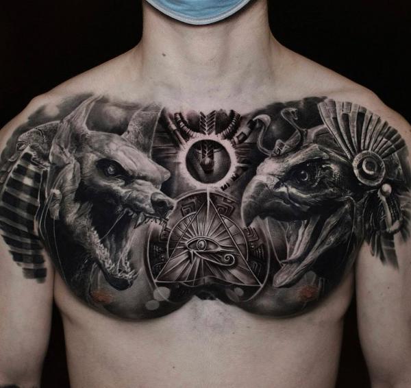 Blackwork Anubis and Horus chest tattoo
