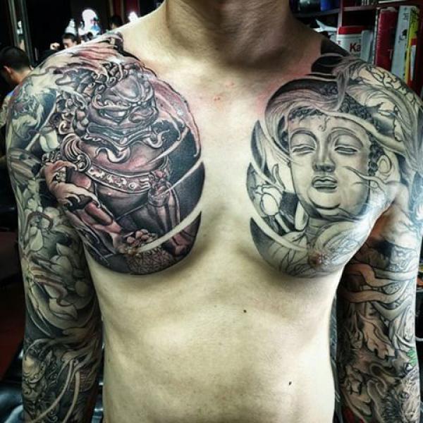 Buddha and foo dog chest tattoo