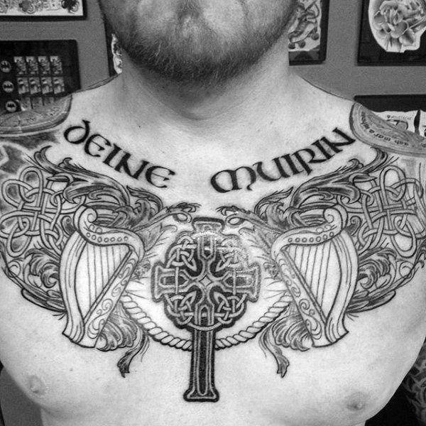 Celtic cross with harp and Dara chest tattoo
