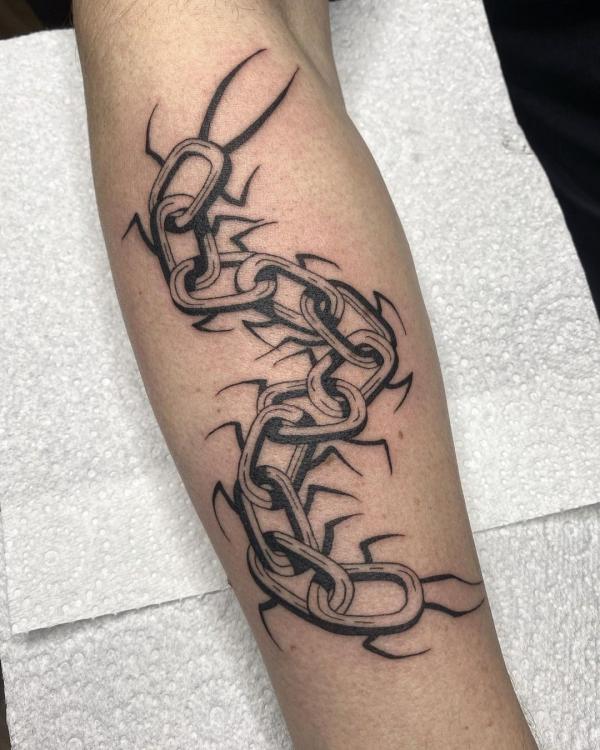 Chain centipede forearm tattoo