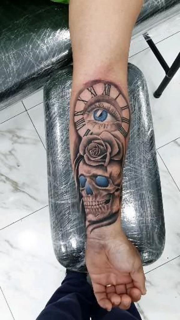 Clock and roae with skull and eye tattoo