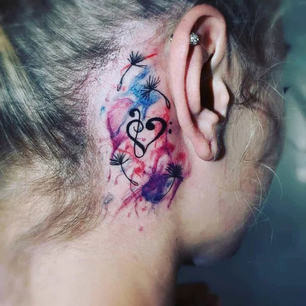 Dandelion and music note heart tattoo behind ear