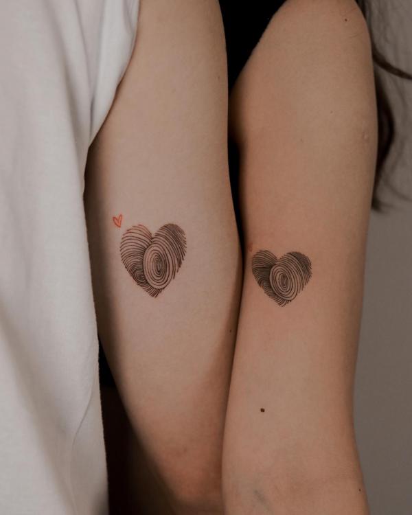 Fingerprint heart tricep tattoo