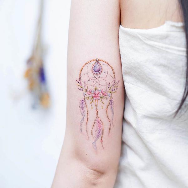 Floral Dreamcatcher tricep tattoo