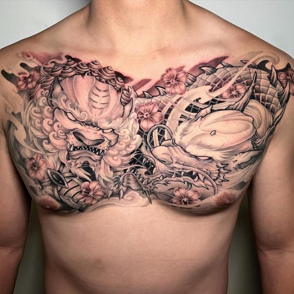 Foo doog and dragon chest tattoo