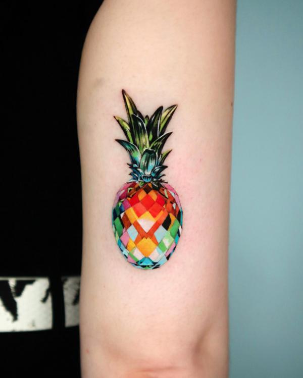 Geometric pineapple tricep tattoo