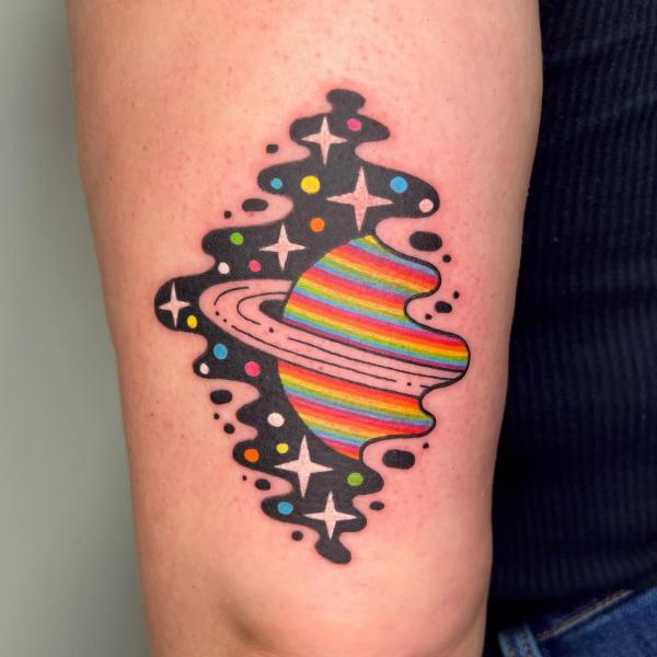Half planet and stars tricep tattoo